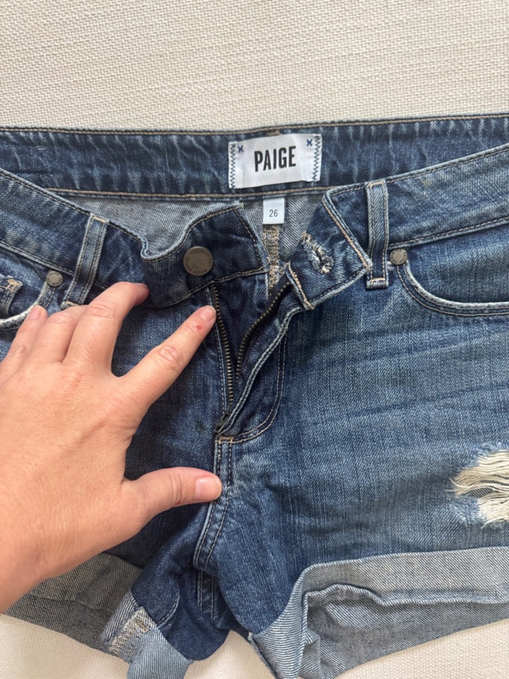 PAIGE Rolled Hem Distressed Denim Shorts in Blue Wash